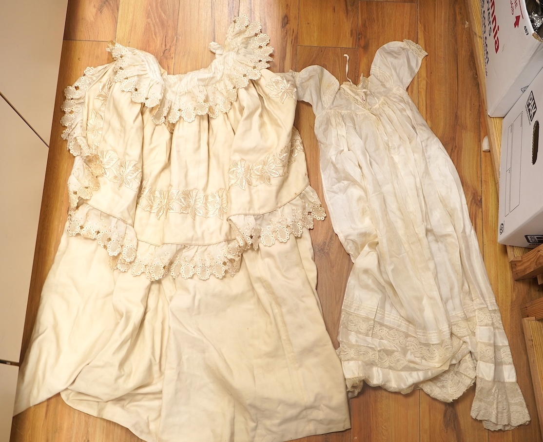 A 19th century cream wool lace and embroidered christening cape and silk baby gown, cape 102cm long. Condition - some stains